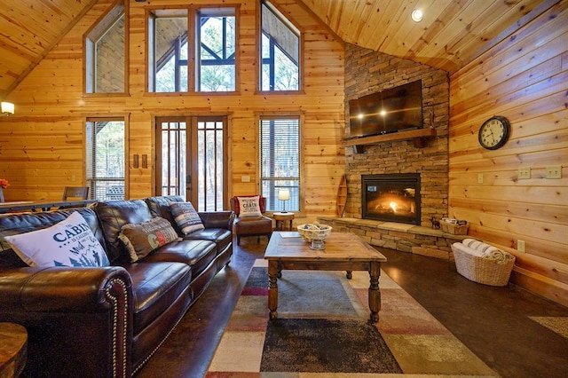 living room featuring a wealth of natural light, high vaulted ceiling, and wooden ceiling