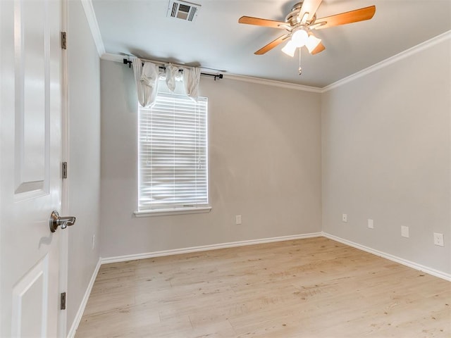 unfurnished room featuring ceiling fan, light hardwood / wood-style flooring, and ornamental molding