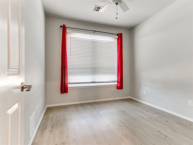 unfurnished room featuring light wood-type flooring and ceiling fan