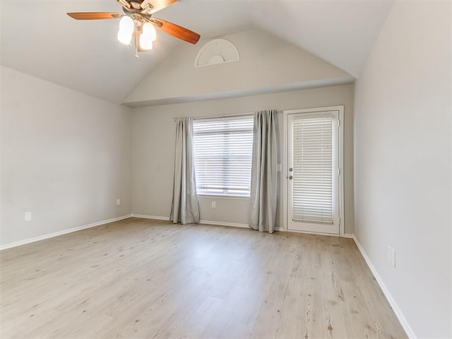 empty room featuring ceiling fan, high vaulted ceiling, and light hardwood / wood-style flooring