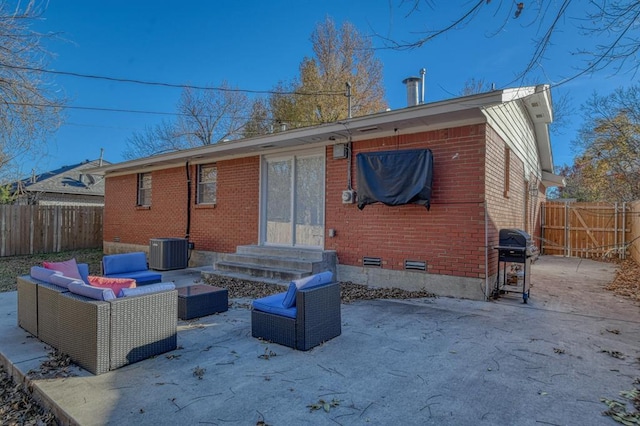 rear view of property with central air condition unit and outdoor lounge area