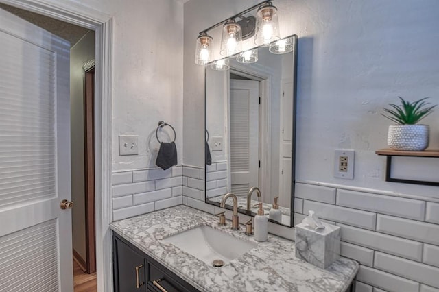 bathroom with vanity and wood-type flooring