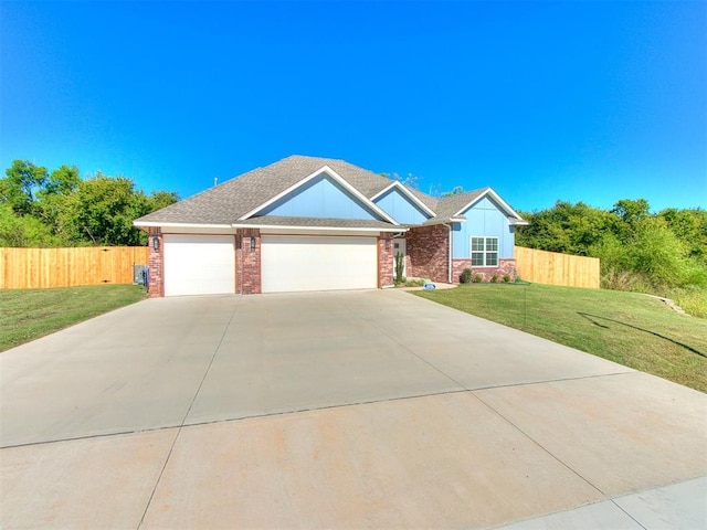 view of front of property with a garage and a front yard