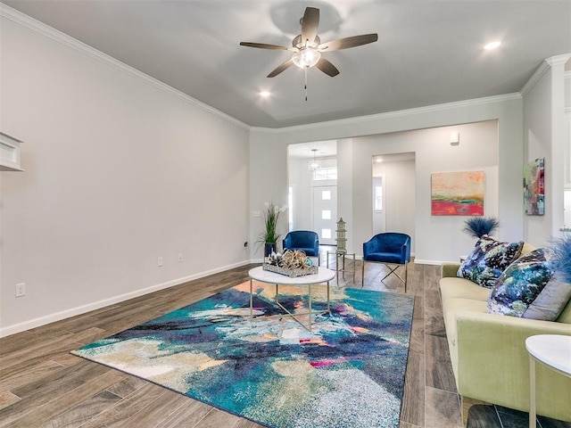 living room with ceiling fan, hardwood / wood-style floors, and ornamental molding