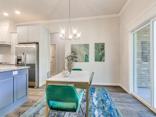 dining space with light hardwood / wood-style flooring, ornamental molding, and a notable chandelier