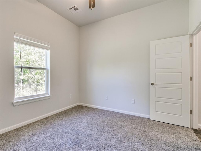 empty room with carpet flooring and ceiling fan