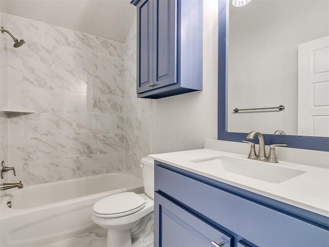 full bathroom featuring vanity, tiled shower / bath combo, and toilet