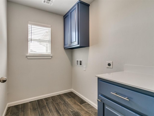 laundry room with washer hookup, electric dryer hookup, cabinets, and dark wood-type flooring