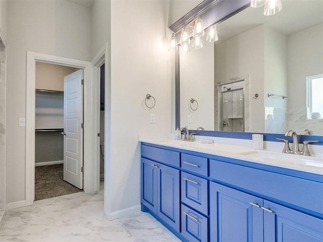 bathroom featuring vanity and an enclosed shower