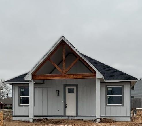 view of front of house featuring roof with shingles and board and batten siding