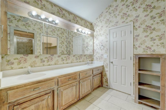 bathroom featuring tile patterned floors, vanity, and an enclosed shower