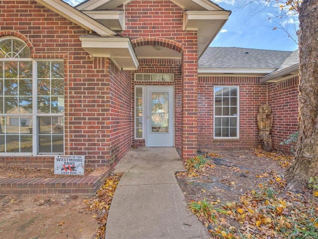 1036 SW 129th St, Moore, OK 73170 - property entrance featuring brick siding and a shingled roof