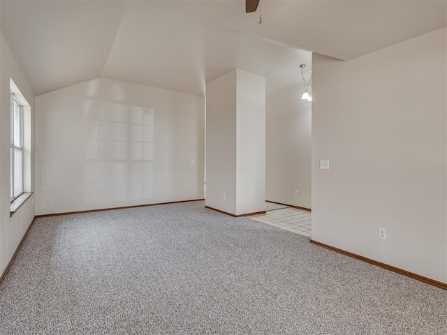 1036 SW 129th St, Moore, OK 73170 - empty room featuring lofted ceiling, light colored carpet, and a ceiling fan