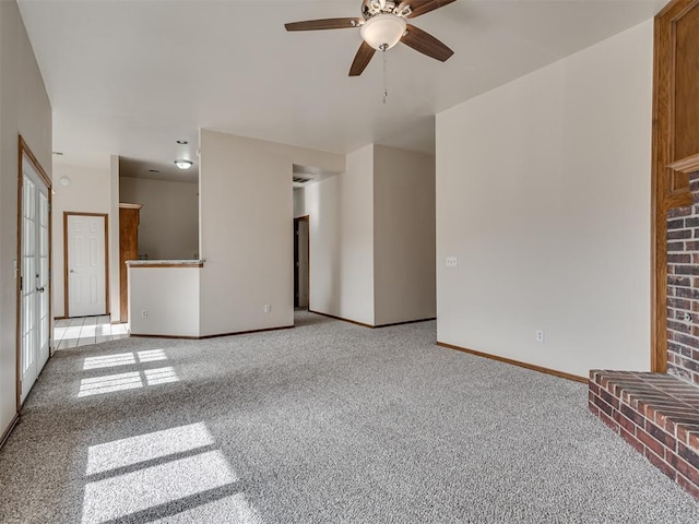 unfurnished living room with light carpet and ceiling fan