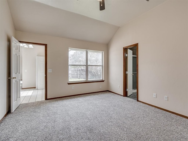 unfurnished bedroom featuring ceiling fan, light colored carpet, and lofted ceiling