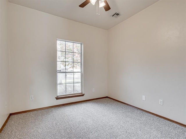 1036 SW 129th St, Moore, OK 73170 - spare room with carpet and a ceiling fan