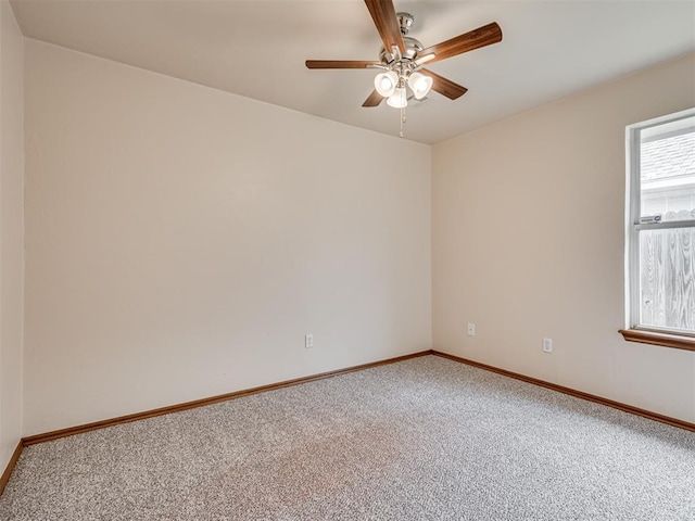 carpeted empty room featuring ceiling fan