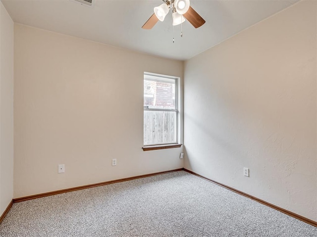 carpeted empty room with ceiling fan