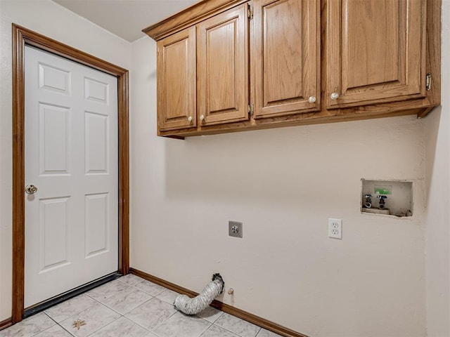 1036 SW 129th St, Moore, OK 73170 - laundry area with hookup for an electric dryer, cabinet space, washer hookup, and light tile patterned floors
