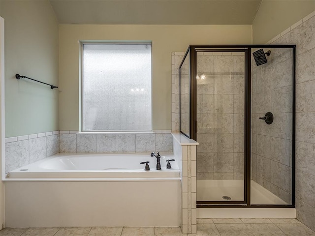 bathroom with tile patterned floors and plus walk in shower