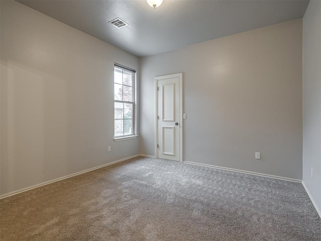 unfurnished room featuring carpet