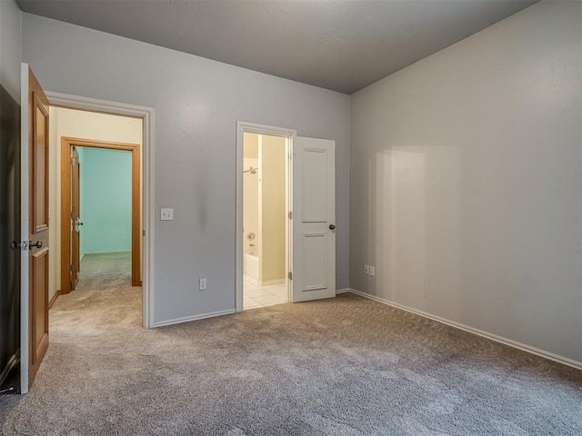 unfurnished bedroom with light carpet