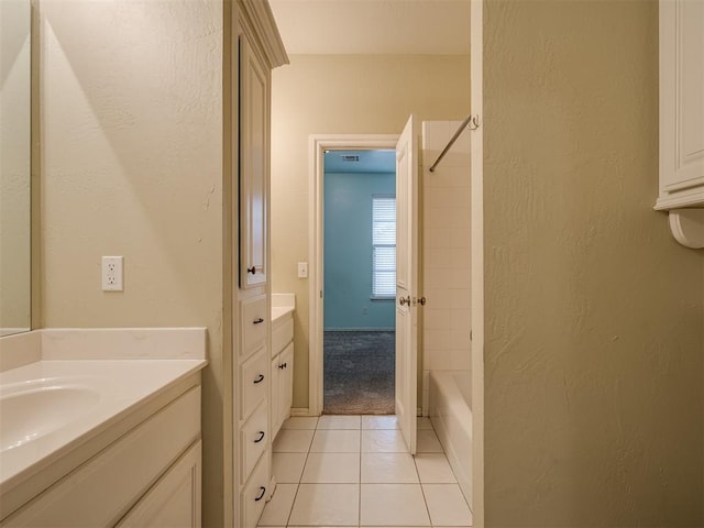 bathroom featuring tile patterned flooring, vanity, and shower / bath combination