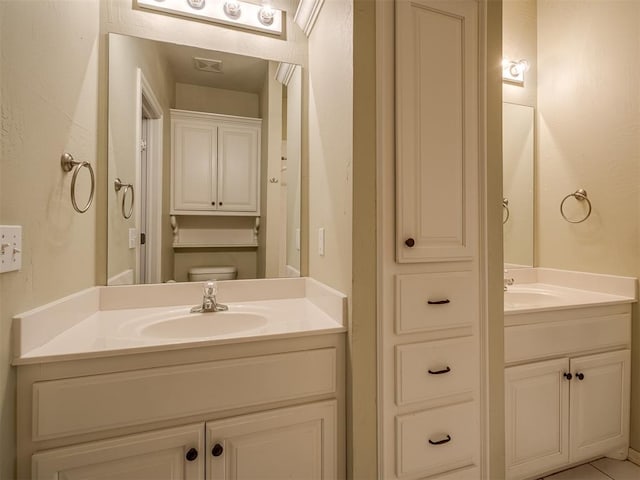 bathroom with vanity and toilet