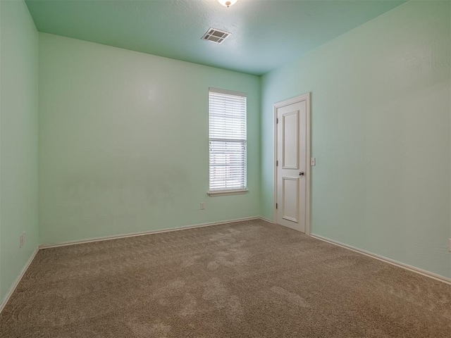 spare room with carpet floors