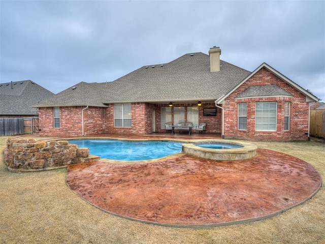 view of pool featuring an in ground hot tub and a patio