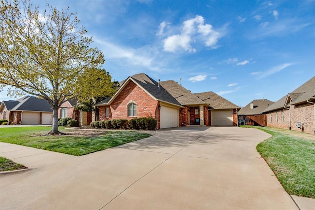 ranch-style home featuring concrete driveway, fence, an attached garage, brick siding, and a front lawn