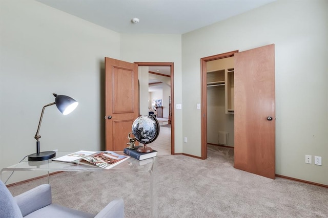 office featuring baseboards and carpet flooring