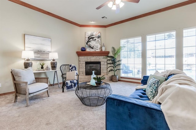 living area featuring carpet flooring, crown molding, a fireplace, and a wealth of natural light