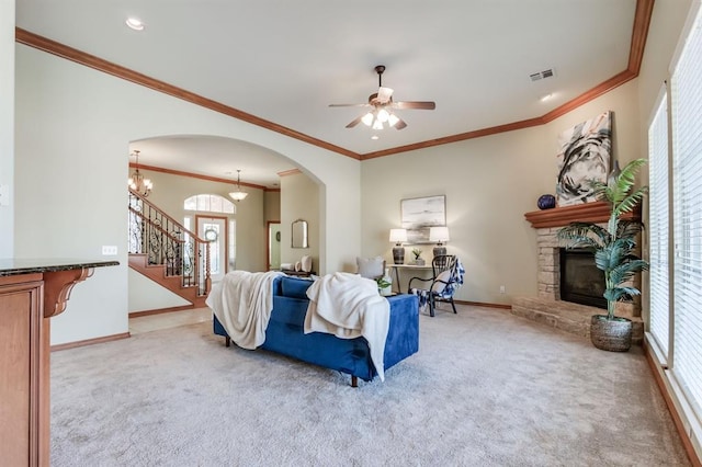 living room with baseboards, a fireplace, visible vents, and light carpet