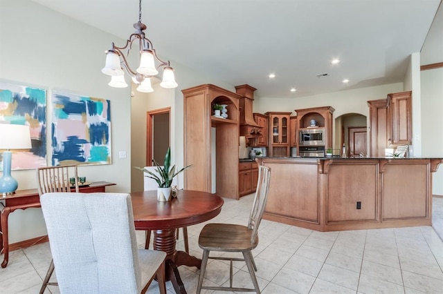 dining space featuring visible vents, a notable chandelier, recessed lighting, arched walkways, and light tile patterned floors