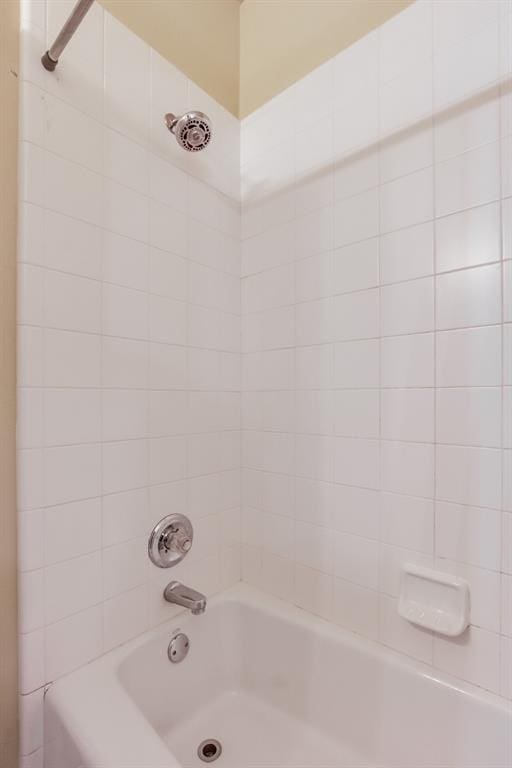 bathroom featuring  shower combination