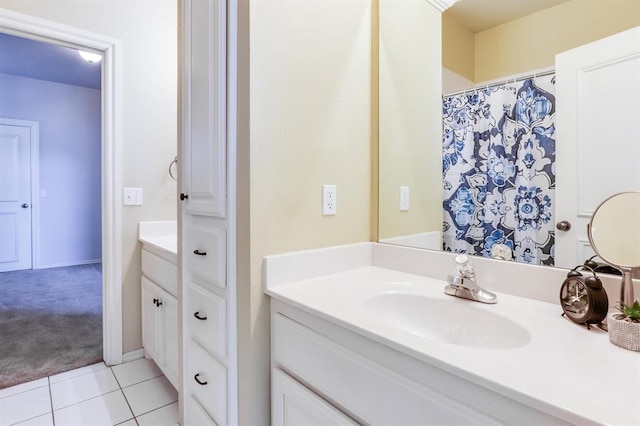 bathroom with tile patterned flooring and vanity