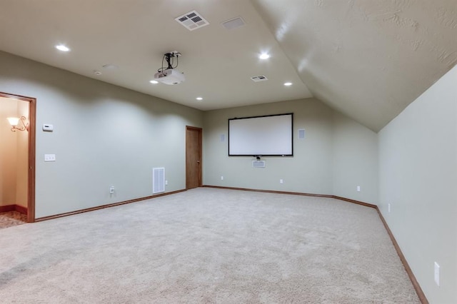 cinema room featuring recessed lighting, light carpet, and visible vents