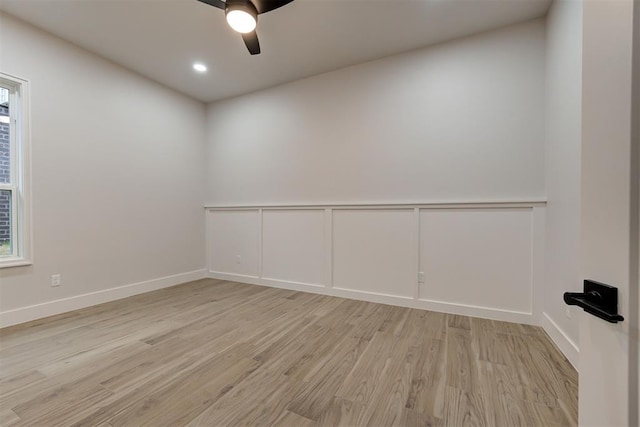 spare room with ceiling fan and light hardwood / wood-style floors