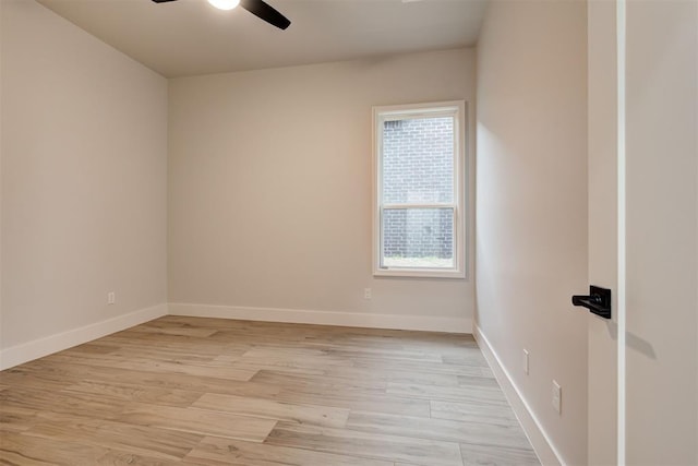 empty room featuring ceiling fan and light hardwood / wood-style flooring