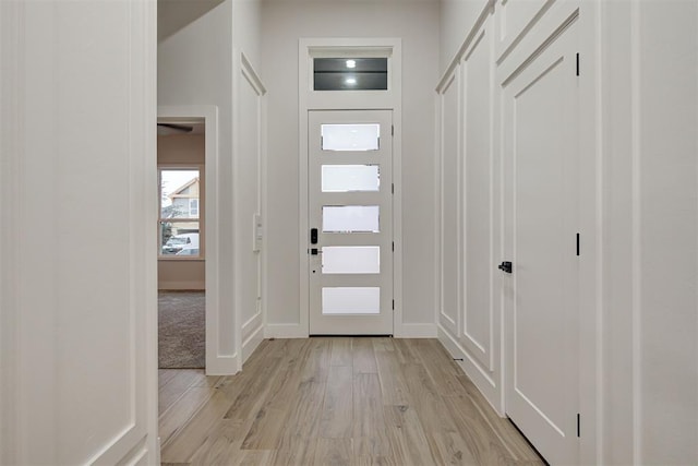 foyer entrance with light wood-type flooring