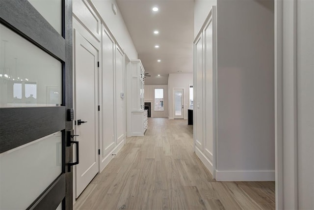 corridor featuring light hardwood / wood-style floors