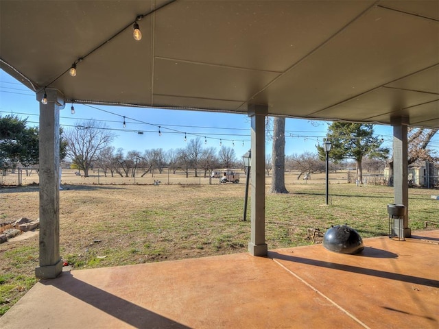 view of yard featuring a patio area and a rural view