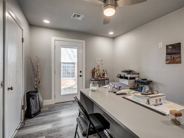 office space with light hardwood / wood-style floors and ceiling fan