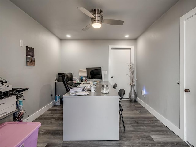 home office with ceiling fan and dark hardwood / wood-style flooring