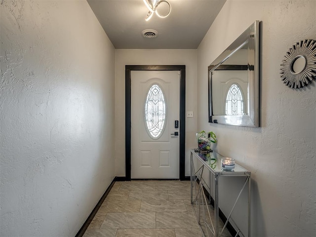 doorway to outside featuring a wealth of natural light