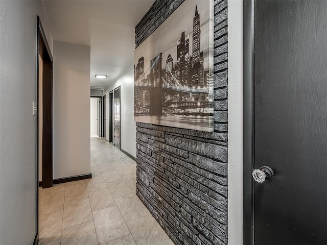 corridor with light tile patterned floors