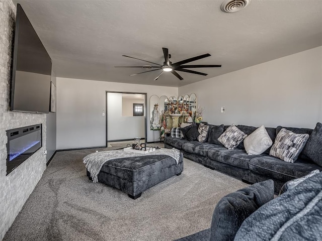 living room featuring ceiling fan and carpet flooring