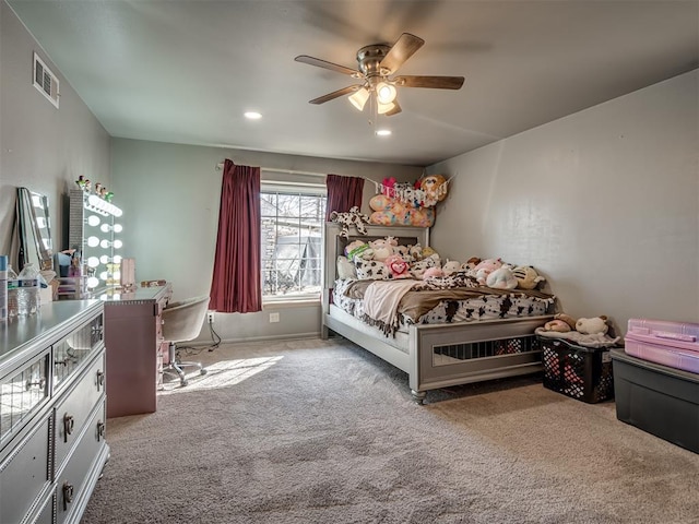 bedroom featuring ceiling fan and carpet