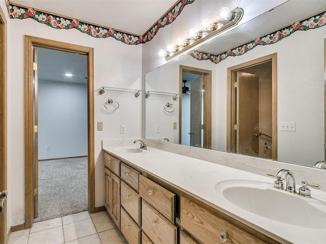 bathroom with tile patterned flooring and vanity